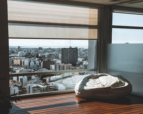 A comfortable bean bag chair near a window meant for reading