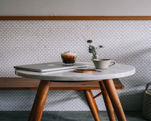 An aesthetic cup of coffee on a minimalist cafe table in Jakarta